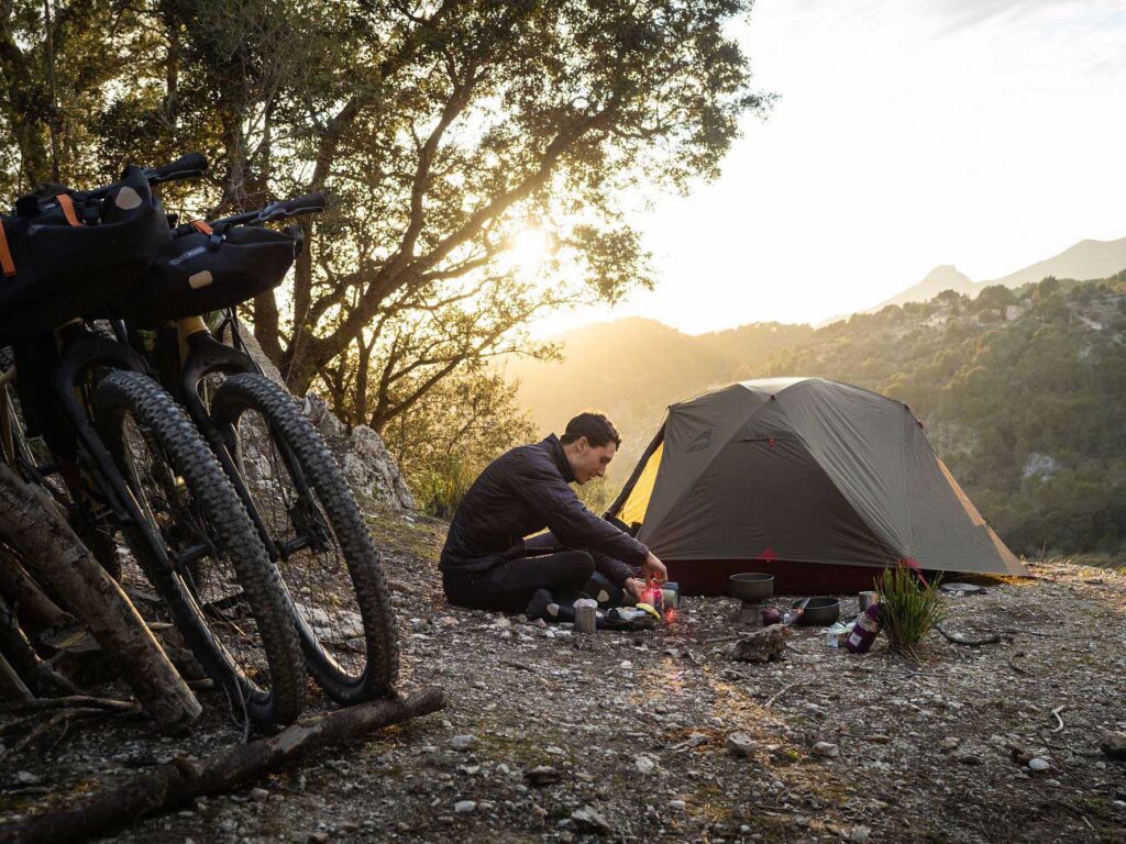 Eating food next to tent